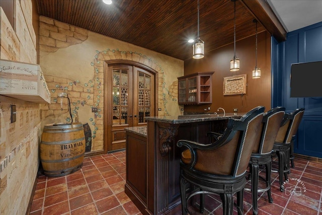 1088 Dunstan Rd, Geneva, IL 60134 - indoor wet bar with wooden ceiling and hanging light fixtures