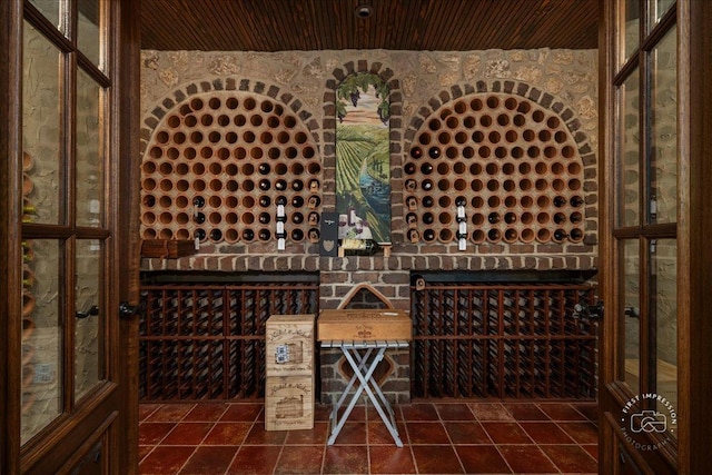 1088 Dunstan Rd, Geneva, IL 60134 - wine room with wooden ceiling and dark tile patterned floors