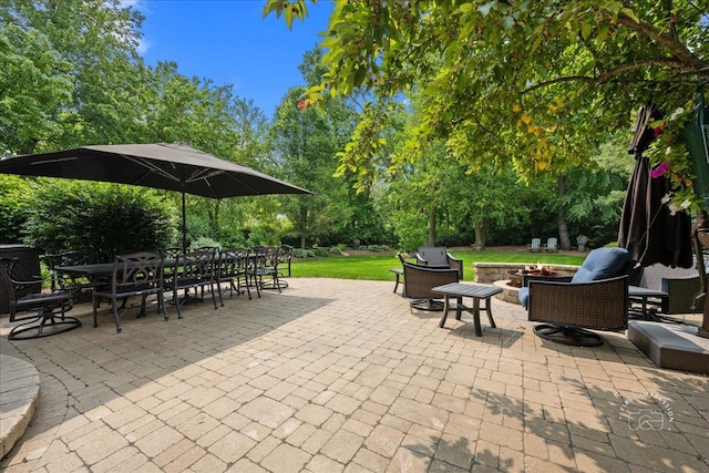 1088 Dunstan Rd, Geneva, IL 60134 - view of patio / terrace with an outdoor fire pit, outdoor dining area, and view of wooded area