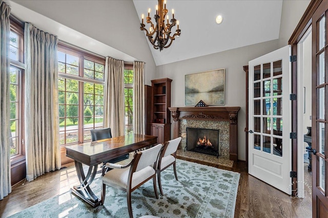 1088 Dunstan Rd, Geneva, IL 60134 - dining room featuring a chandelier, a high end fireplace, wood finished floors, and high vaulted ceiling
