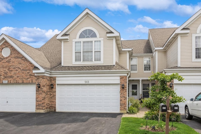 513 Citadel Cir, Westmont, IL 60559 - view of front facade with brick siding, roof with shingles, driveway, and a garage