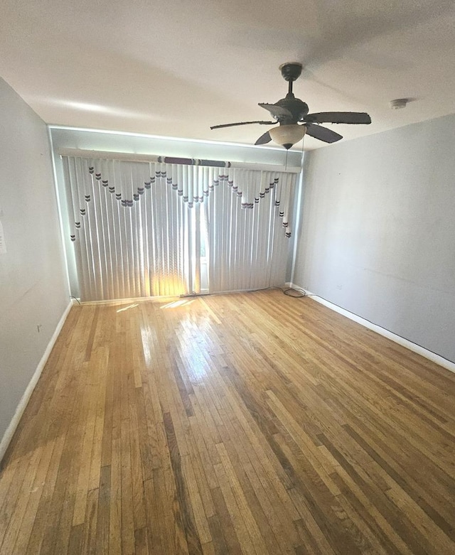 15210 Evers St, Dolton, IL 60419 - unfurnished room with wood-type flooring, baseboards, and a ceiling fan