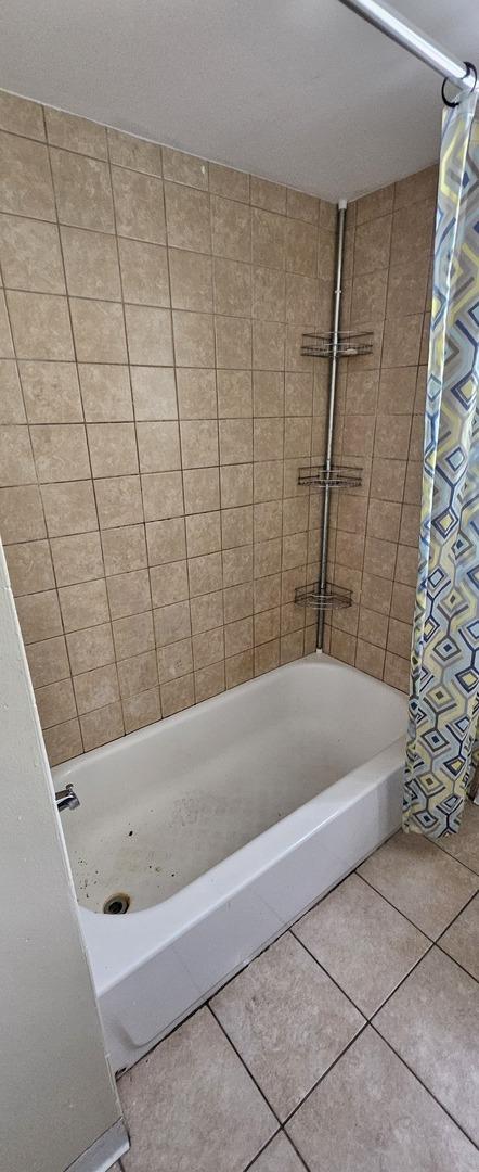 15210 Evers St, Dolton, IL 60419 - full bath featuring shower / bath combination with curtain and tile patterned floors