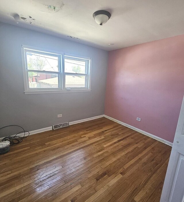 15210 Evers St, Dolton, IL 60419 - spare room featuring wood finished floors and baseboards