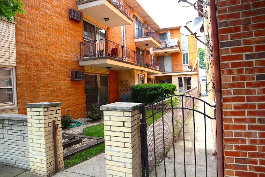 3914 W 63rd St Unit 1-A, Chicago, IL 60629 - gate with an AC wall unit