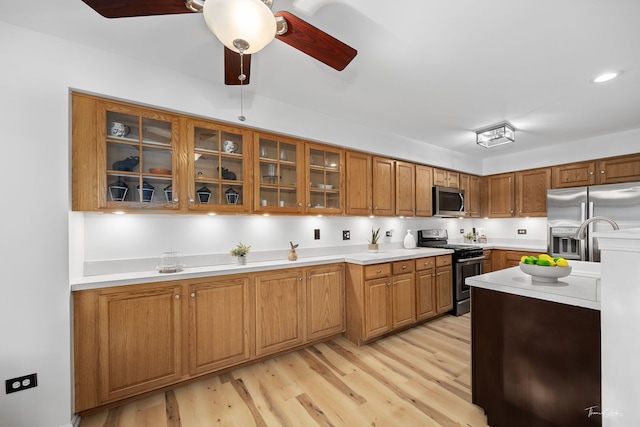 1910 Baldwin Way, Bolingbrook, IL 60490 - kitchen with stainless steel appliances, light wood-style floors, light countertops, brown cabinets, and recessed lighting