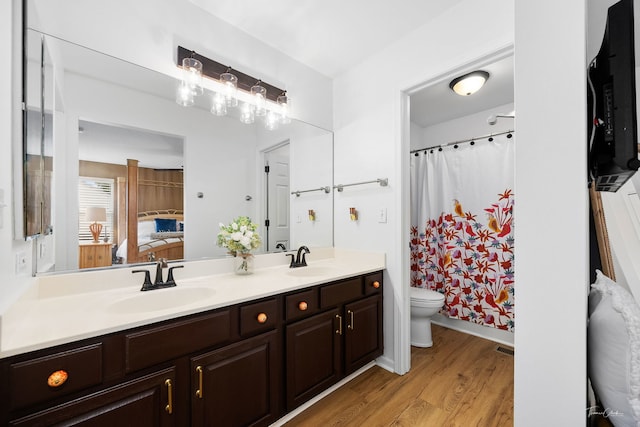 1910 Baldwin Way, Bolingbrook, IL 60490 - full bathroom with double vanity, ensuite bath, wood finished floors, and a shower with curtain