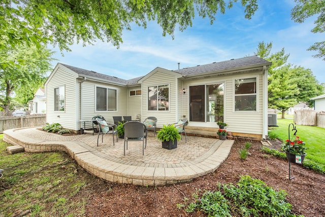 1910 Baldwin Way, Bolingbrook, IL 60490 - rear view of property with a patio area