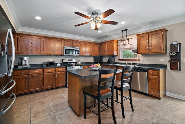 24450 Shawnee Ln, Manhattan, IL 60442 - kitchen featuring stainless steel appliances, ornamental molding, a ceiling fan, a center island, and light tile patterned floors