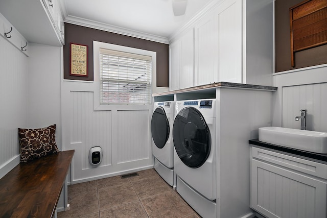 24450 Shawnee Ln, Manhattan, IL 60442 - laundry room with washer and clothes dryer, cabinet space, crown molding, and tile patterned floors