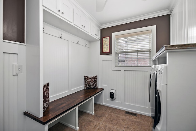 24450 Shawnee Ln, Manhattan, IL 60442 - laundry room featuring crown molding, cabinet space, independent washer and dryer, and dark tile patterned floors