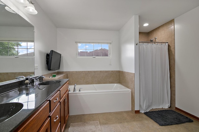 24450 Shawnee Ln, Manhattan, IL 60442 - bathroom featuring double vanity, plenty of natural light, a tile shower, and tile patterned floors
