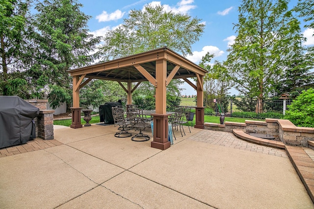 24450 Shawnee Ln, Manhattan, IL 60442 - fenced backyard with a gazebo, outdoor dining area, a patio area, and a grill