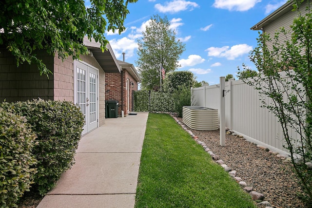 24450 Shawnee Ln, Manhattan, IL 60442 - view of yard featuring french doors and a patio