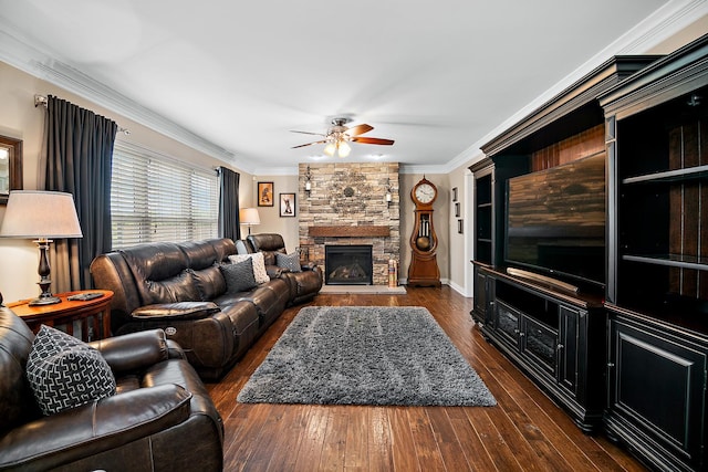24450 Shawnee Ln, Manhattan, IL 60442 - living area featuring ceiling fan, crown molding, dark wood-style floors, and a stone fireplace