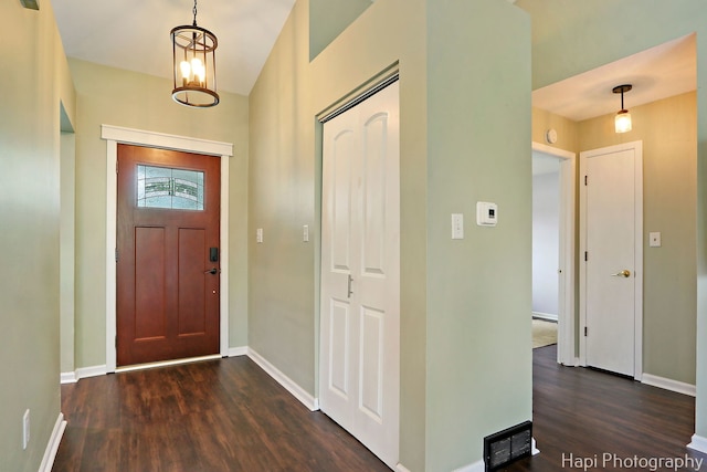 4008 W Lillian St, Mchenry, IL 60050 - foyer with dark wood-style flooring and a chandelier