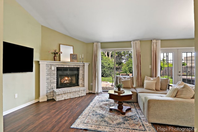 4008 W Lillian St, Mchenry, IL 60050 - living area featuring plenty of natural light, dark wood-style flooring, a brick fireplace, french doors, and vaulted ceiling
