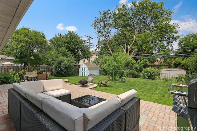 4008 W Lillian St, Mchenry, IL 60050 - view of patio / terrace with a shed, an outdoor living space with a fire pit, grilling area, and outdoor dining space