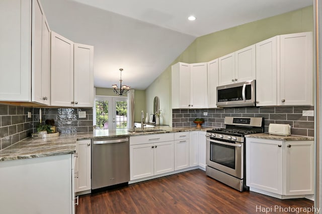 4008 W Lillian St, Mchenry, IL 60050 - kitchen featuring stainless steel appliances, lofted ceiling, dark wood-type flooring, a chandelier, and white cabinets