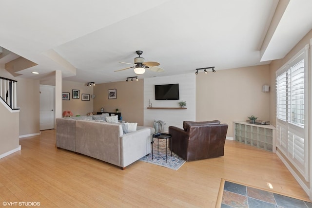 6N142 Riverside Dr, Saint Charles, IL 60175 - living room with light wood finished floors, a ceiling fan, rail lighting, and stairway