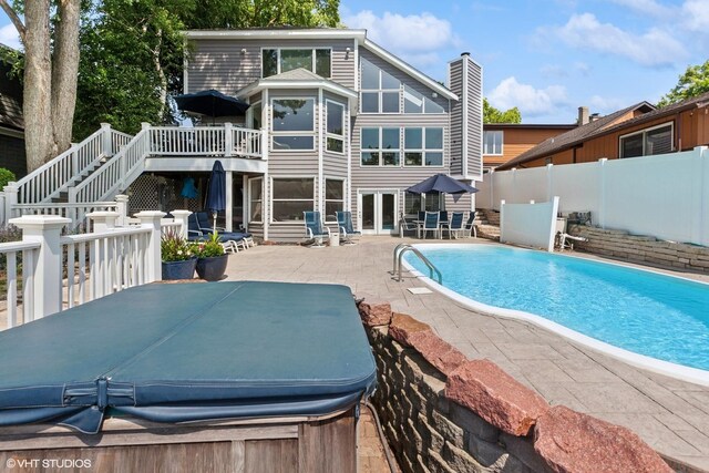 6N142 Riverside Dr, Saint Charles, IL 60175 - back of house with stairway, a patio, a hot tub, a fenced backyard, and a deck