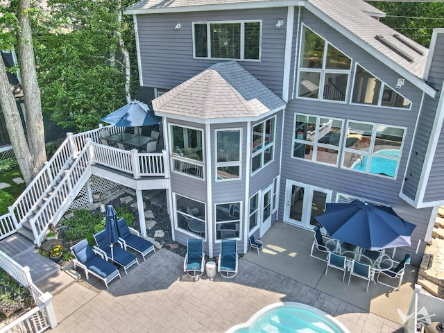 6N142 Riverside Dr, Saint Charles, IL 60175 - back of property with roof with shingles, a patio area, a deck, stairs, and outdoor dining space