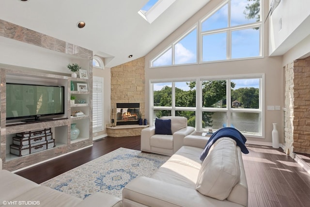 6N142 Riverside Dr, Saint Charles, IL 60175 - living room featuring high vaulted ceiling, a fireplace, and dark wood-style flooring