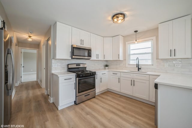 364 Hoxie Ave, Calumet City, IL 60409 - kitchen with appliances with stainless steel finishes, decorative backsplash, light wood-style floors, and white cabinets