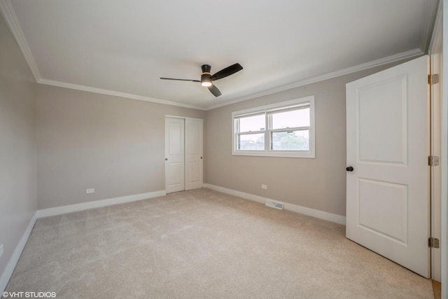 364 Hoxie Ave, Calumet City, IL 60409 - unfurnished bedroom with crown molding, light colored carpet, a closet, and ceiling fan