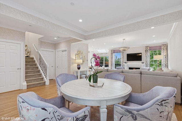 37 Harborside Way, Hawthorn Woods, IL 60047 - dining room with light wood-style flooring, stairs, recessed lighting, crown molding, and a lit fireplace