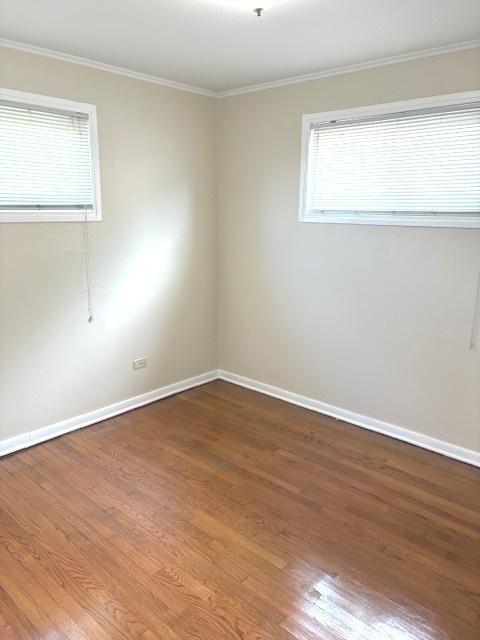 12636 S Loomis St, Calumet Park, IL 60827 - empty room featuring wood finished floors and ornamental molding