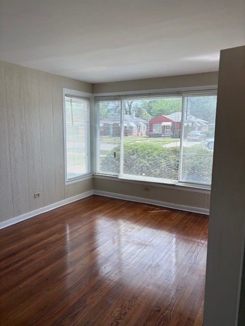 12636 S Loomis St, Calumet Park, IL 60827 - spare room featuring dark wood-style flooring and baseboards