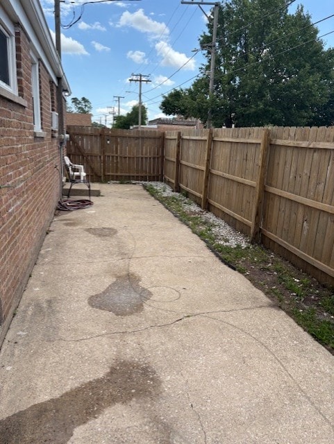 12636 S Loomis St, Calumet Park, IL 60827 - fenced backyard with a patio
