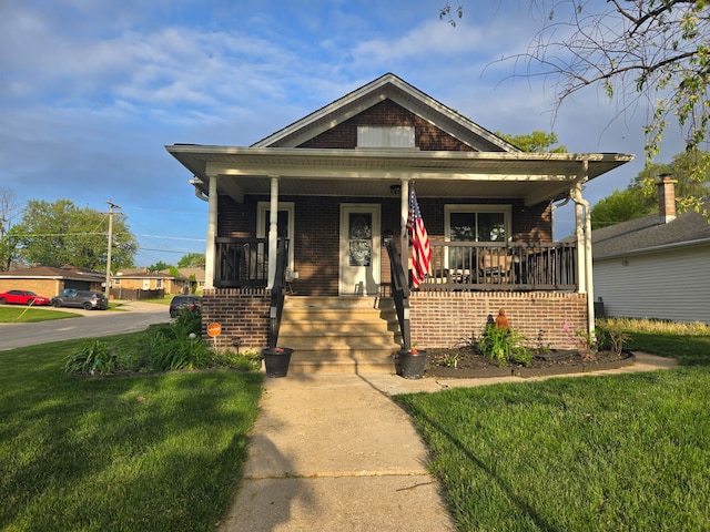 1901 Cora St, Crest Hill, IL 60403 - bungalow-style home featuring brick siding, a front lawn, and covered porch