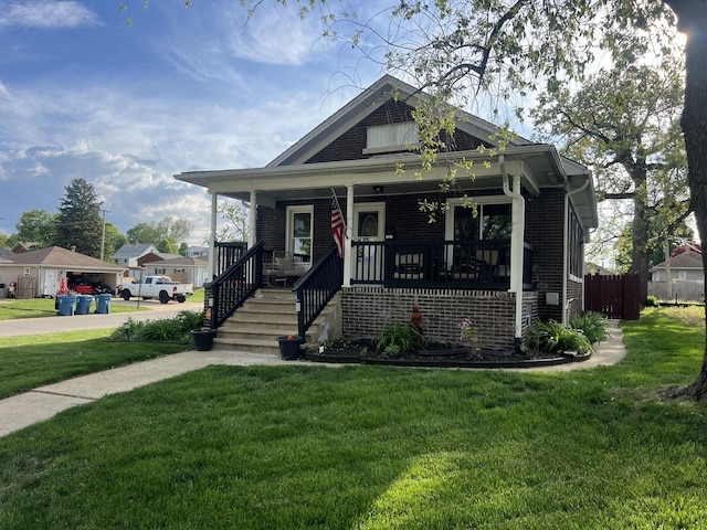1901 Cora St, Crest Hill, IL 60403 - view of front of home featuring a front lawn, covered porch, and brick siding