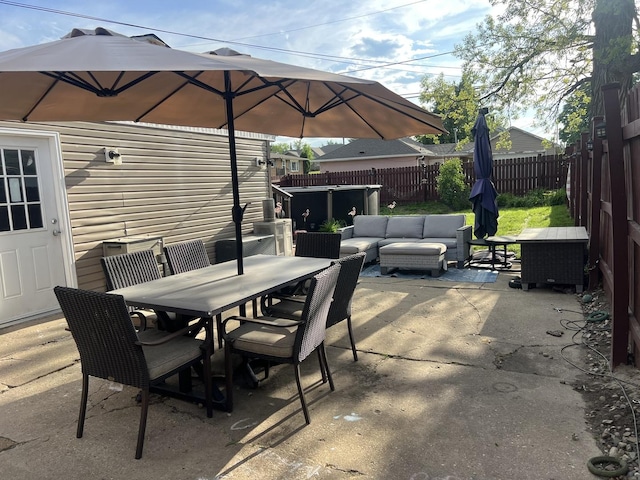 1901 Cora St, Crest Hill, IL 60403 - fenced backyard featuring outdoor dining area, an outdoor hangout area, and a patio area