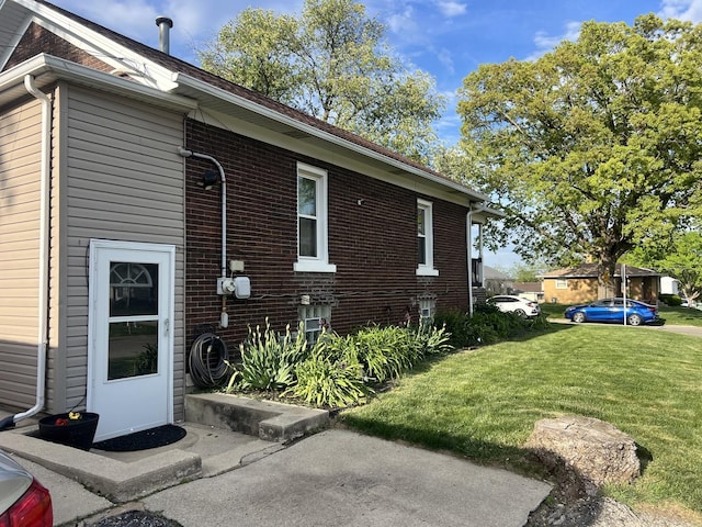 1901 Cora St, Crest Hill, IL 60403 - view of property exterior with a yard and brick siding