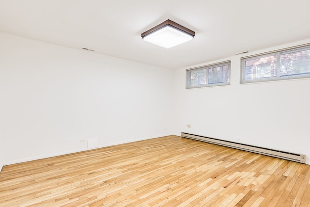 5400 S Hyde Park Blvd Unit 10C, Chicago, IL 60615 - empty room with a baseboard radiator and wood-type flooring