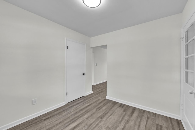 2270 177th St, Lansing, IL 60438 - empty room with wood finished floors and baseboards