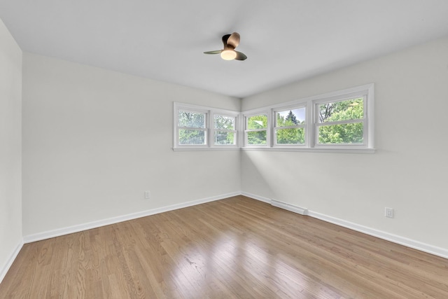 2270 177th St, Lansing, IL 60438 - spare room featuring baseboards, wood finished floors, and a ceiling fan