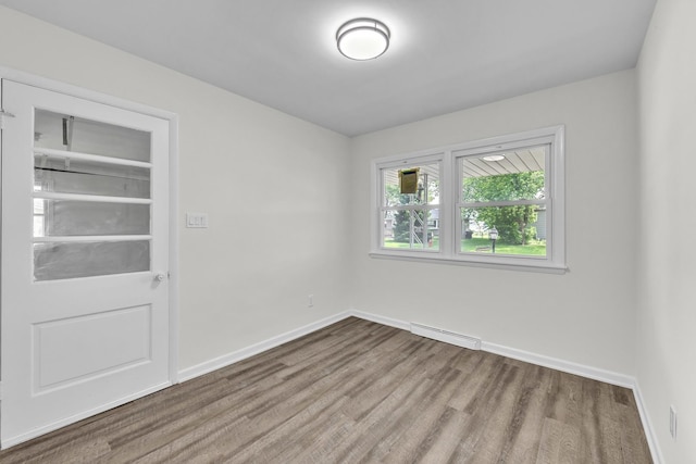 2270 177th St, Lansing, IL 60438 - empty room featuring wood finished floors, baseboards, and baseboard heating