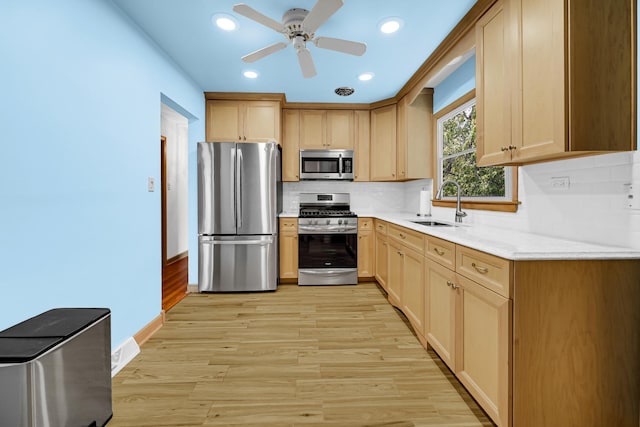 10021 Cook Ave, Oak Lawn, IL 60453 - kitchen with stainless steel appliances, decorative backsplash, light wood-style floors, light countertops, and a ceiling fan