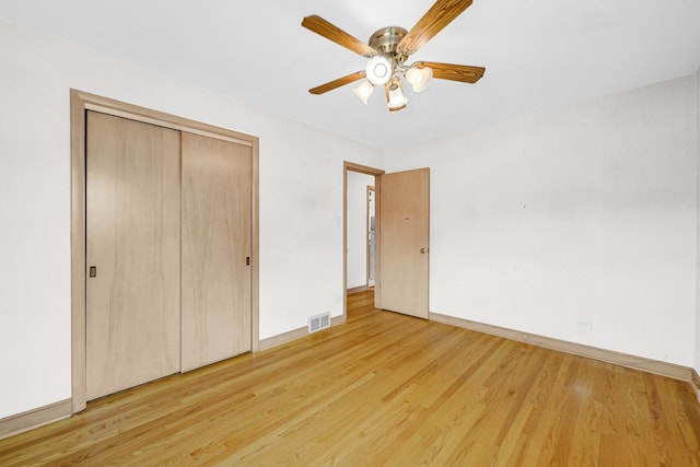 10021 Cook Ave, Oak Lawn, IL 60453 - unfurnished bedroom featuring light wood-style flooring, a closet, and a ceiling fan