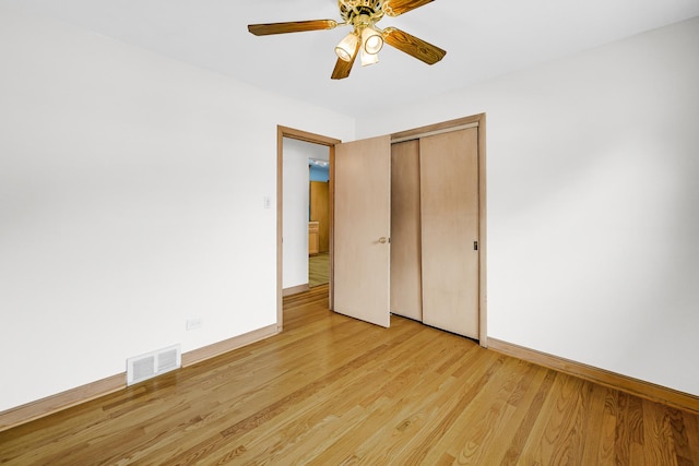 10021 Cook Ave, Oak Lawn, IL 60453 - unfurnished bedroom featuring light wood-type flooring, a closet, and ceiling fan