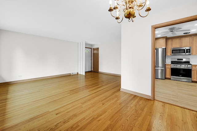 10021 Cook Ave, Oak Lawn, IL 60453 - unfurnished living room featuring a chandelier and light wood-style floors