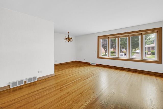 10021 Cook Ave, Oak Lawn, IL 60453 - empty room with a chandelier and light wood-type flooring