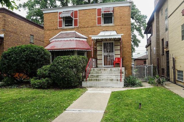 9134 S Justine St, Chicago, IL 60620 - view of front facade with brick siding and a gate