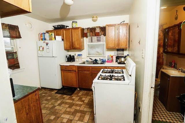 9134 S Justine St, Chicago, IL 60620 - kitchen featuring white appliances, a sink, brown cabinets, and brick patterned flooring