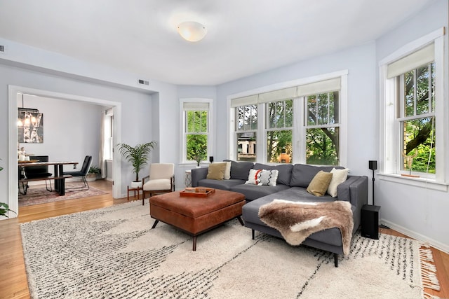 2127 W Pierce Ave Unit 2A, Chicago, IL 60622 - living room with light wood finished floors and a chandelier