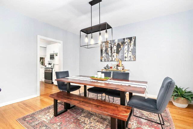 2127 W Pierce Ave Unit 2A, Chicago, IL 60622 - dining space with wood finished floors and baseboards